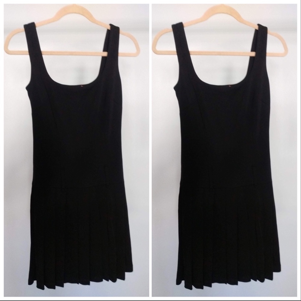 Black dress with pleated bottom.